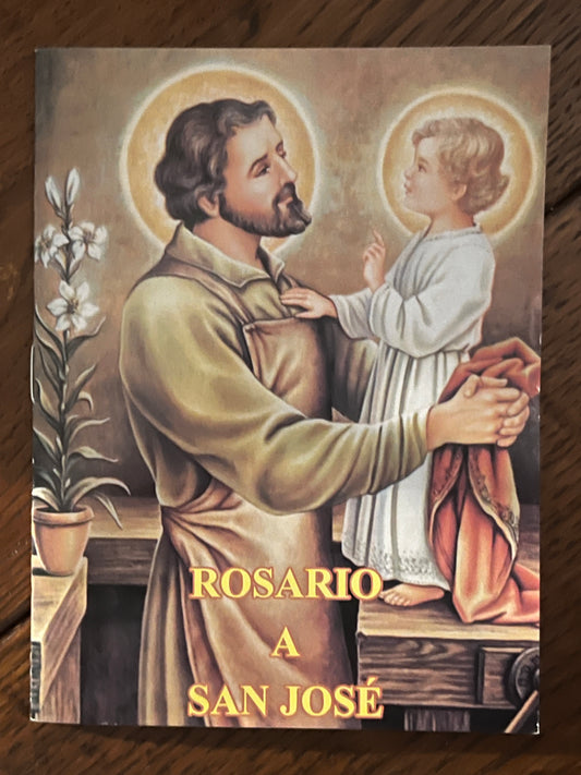 Spanish prayer book titled Rosario a San Jose with illustration of Saint Joseph holding baby Jesus with halos