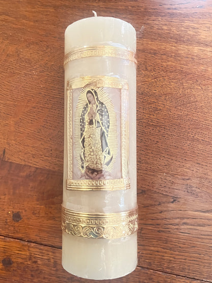 Our Lady of Guadalupe beeswax candle 7 3/4" with gold decorative borders on wooden surface