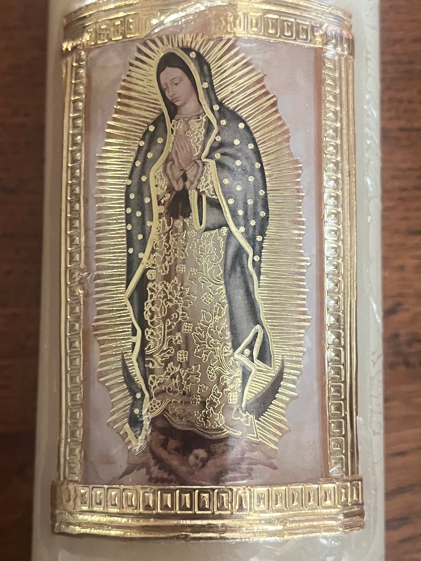 Our Lady of Guadalupe image on beeswax candle with gold embossed border and intricate detailing