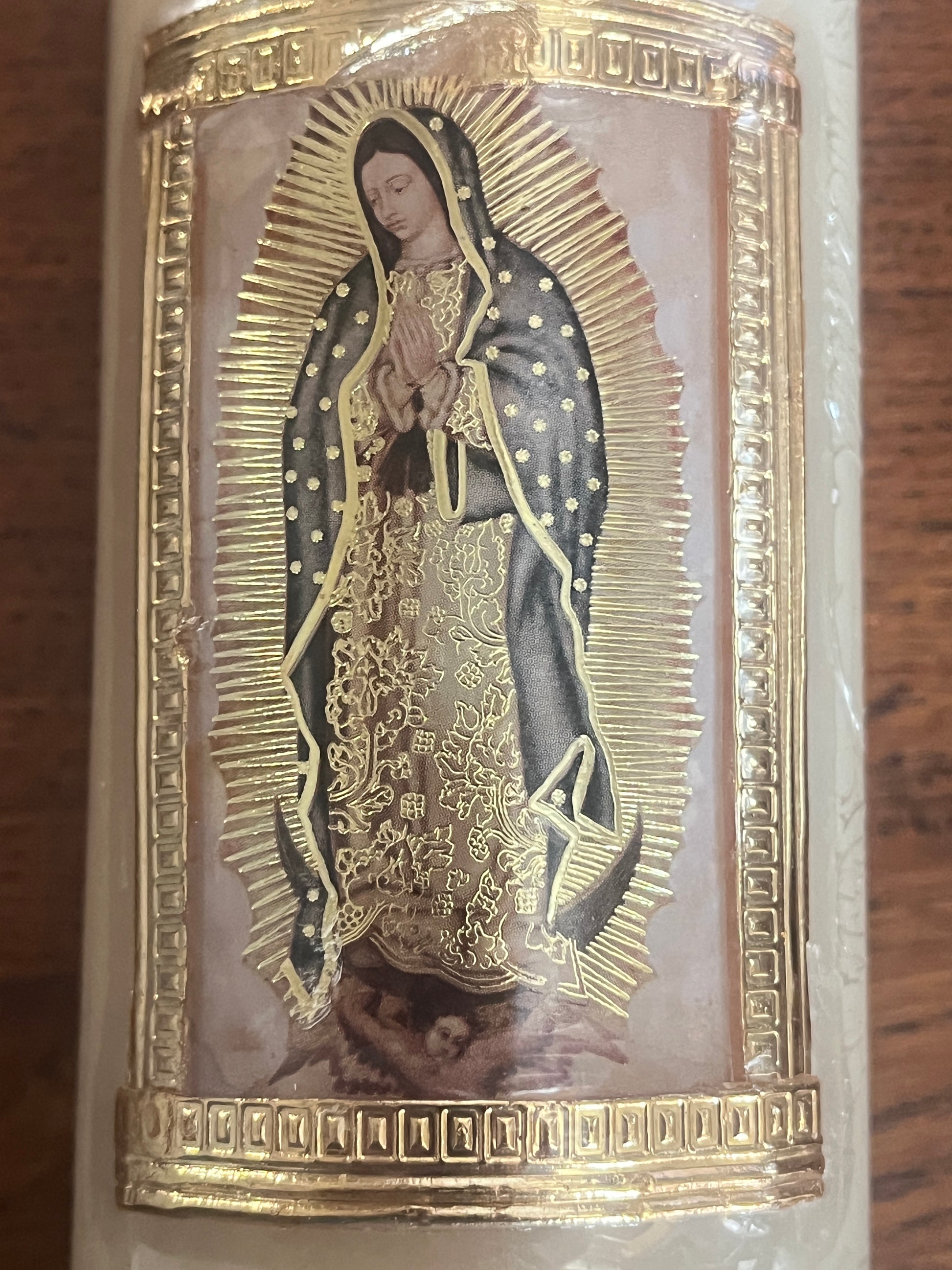 Our Lady of Guadalupe image on beeswax candle with gold embossed border and intricate detailing