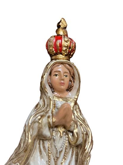 6" statue of Our Lady of Fatima crowned wearing white and gold robes with hands joined in prayer