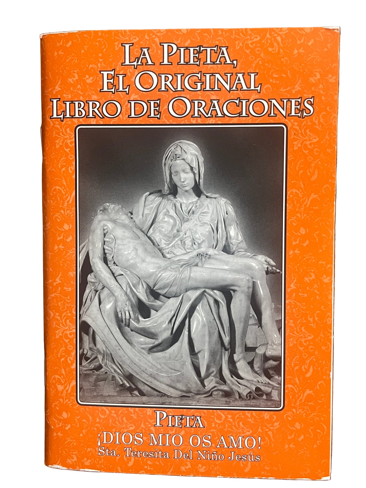Orange cover of La Pieta El Original Libro de Oraciones book featuring a black and white Pieta sculpture image