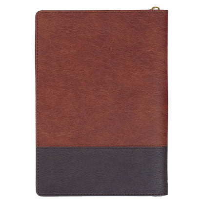 Two-tone brown faux leather journal with zipper closure and smooth stitched edges for writing and reflection