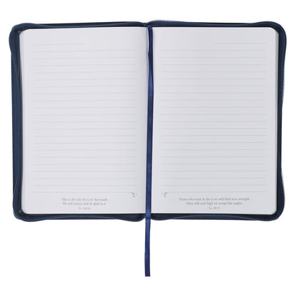 Open Strong and Courageous blue faux leather journal with lined pages and inspirational Bible verses at bottom edges