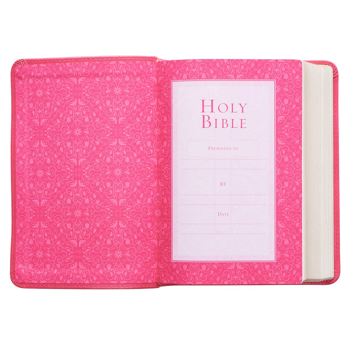 Pink faux leather large print compact King James Version Bible open to decorative presentation page with floral pattern interior