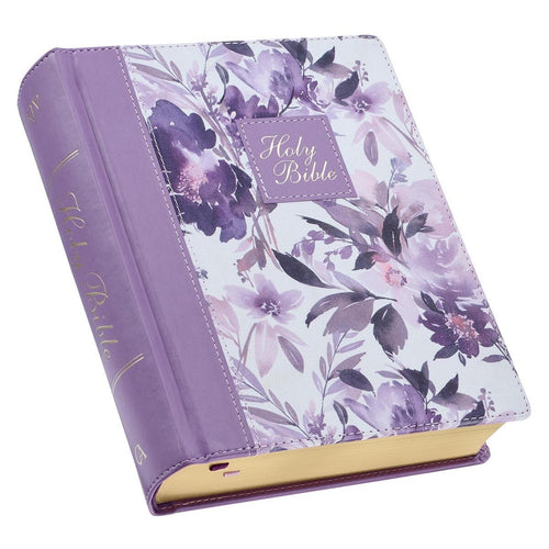 Purple floral faux leather hardcover Holy Bible with gold-edged pages and decorative script on spine and cover