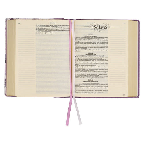 Open Purple Floral faux leather hardcover Bible showing Psalms with note-taking margins and two satin ribbon markers