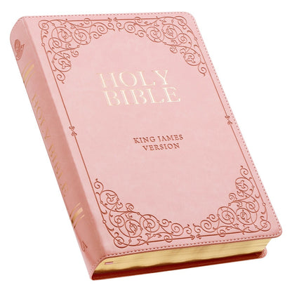 Pink faux leather full-size King James Version Bible with gold-foiled title and ornate corner scrollwork design