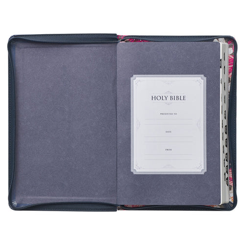 Floral blue faux leather King James Bible open to presentation page with thumb index and zippered closure