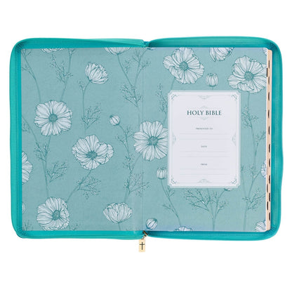 Vibrant teal faux leather thinline King James Bible with floral endpapers, zippered closure, and thumb index tabs