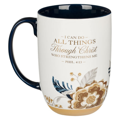 Ceramic mug with honey-brown and blue floral design, exposed clay base, and Philippians 4:13 scripture text