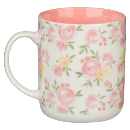 Ceramic coffee mug with pink and yellow rose pattern and soft pink interior for morning encouragement