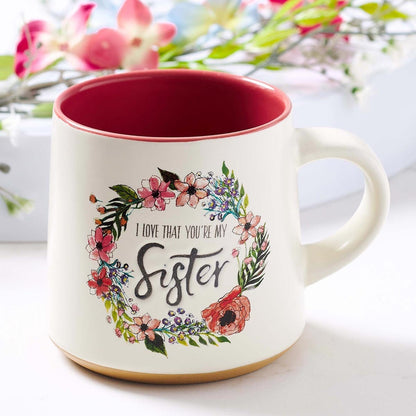 Ceramic Sister coffee mug with floral wreath design, clay dipped base, and red interior, Ecclesiastes 4:9 inscription