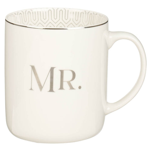 White ceramic coffee mug with MR. in gray lettering and geometric pattern inside rim, smooth handle design