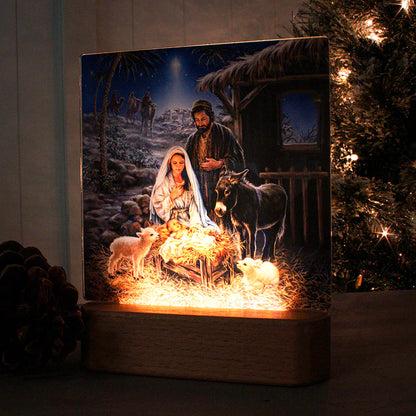 LED nightlight tabletop plaque depicting nativity scene with Mary, Joseph, baby Jesus, animals, and starry night background
