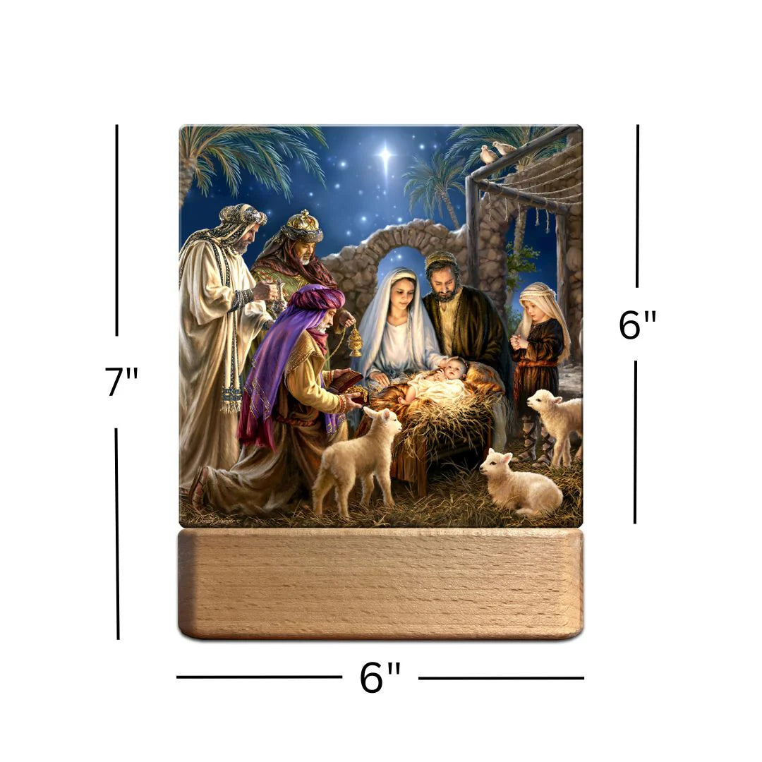 Nativity scene tabletop ornament plaque nightlight depicting Mary, Joseph, baby Jesus, wisemen, and lambs with wooden base