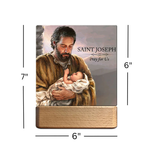 7" Saint Joseph LED nightlight showing hand-painted image of Saint Joseph holding baby Jesus with prayer text and wooden base