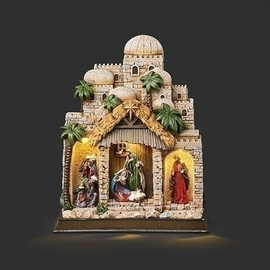 11" lighted Nativity scene in town setting with Holy Family figures and detailed palm trees on tabletop ornament