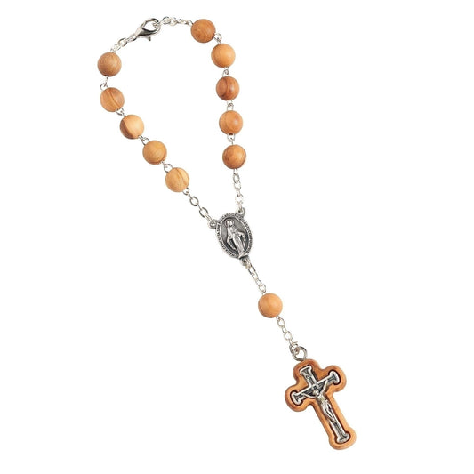 Olive wood auto rosary with silver Miraculous Medal centerpiece and crucifix on white background