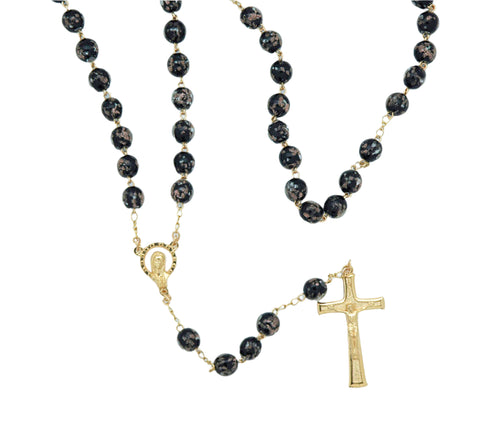 Luminous glass rosary from Fatima with black glowing beads, gold-tone chain, detailed medal and crucifix pendant