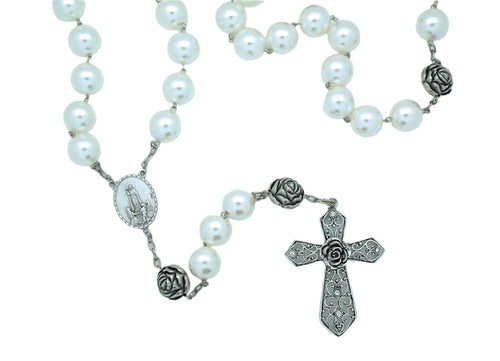 Pearl wall rosary with lustrous beads, detailed silver cross, and floral connector medallion for home decor and devotion