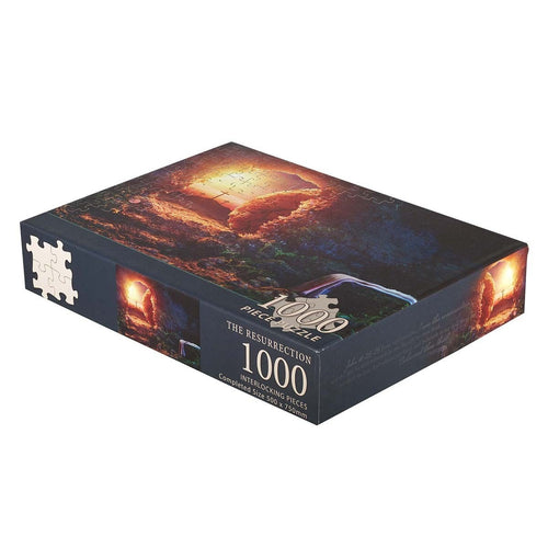 1000-piece jigsaw puzzle titled The Resurrection with glowing tomb and cross artwork on dark background box