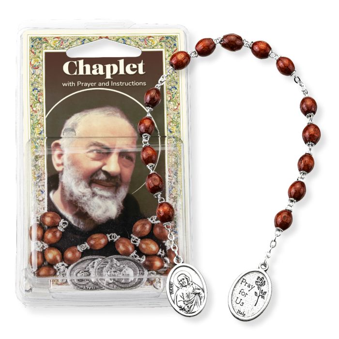 St. Padre Pio chaplet with oval wood beads, silver-tone medals, prayer card, and instructions in clear packaging