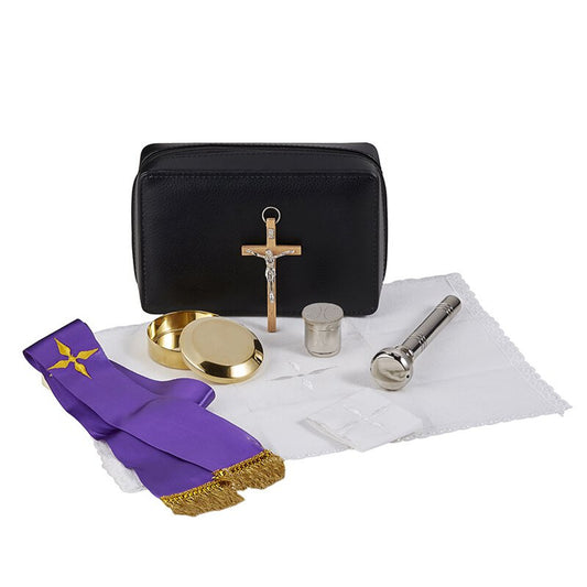 Pastoral Sick Call set with black zippered case, crucifix, purple stole, pyx, holy oil stock, and white cloth on white background