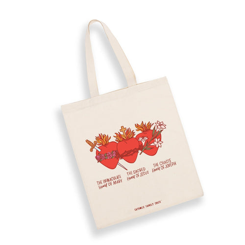 Natural cotton canvas tote bag with illustrated Immaculate, Sacred, and Chaste Hearts and religious text