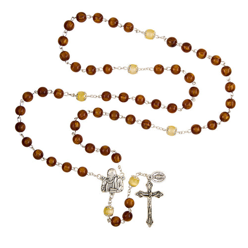 Canticle of the Sun Padre Pio Miraculous Rosary with amber-toned beads and detailed silver crucifix and medallion centerpiece