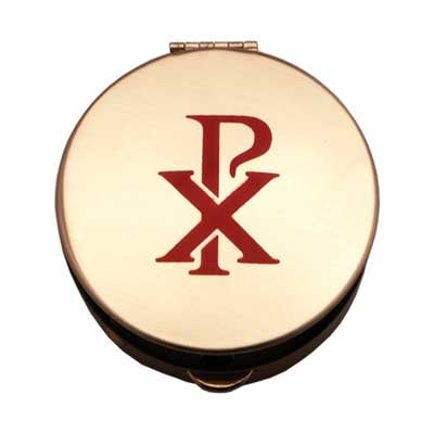 Round gold pyx with red Chi-Rho symbol on lid, 1 1/2 inch size for carrying the Eucharist discreetly