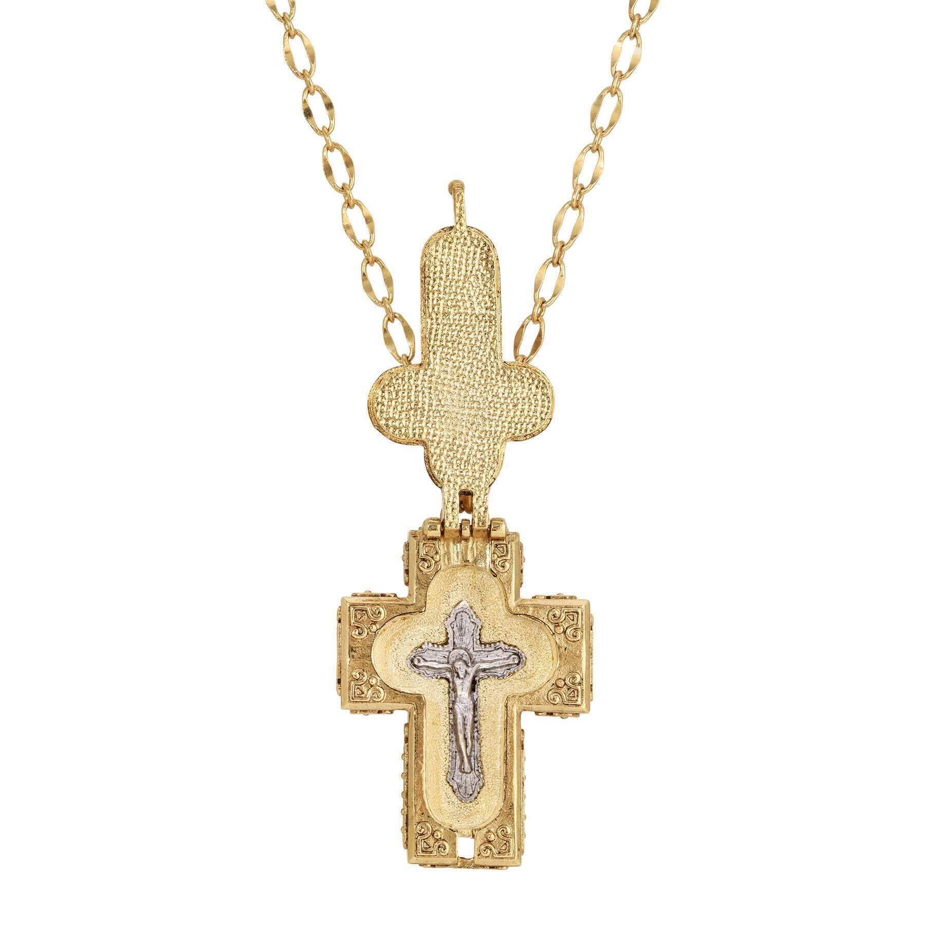 Gold-tone reliquary pendant necklace with detailed cross, hinged locket, and delicate chain link design