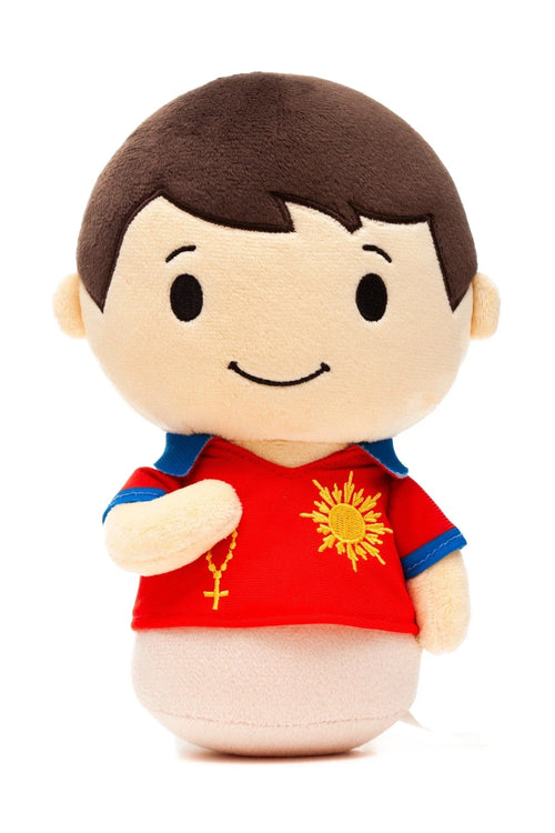 Saint Carlo Acutis plush doll wearing red shirt with sun emblem and holding a small rosary necklace on white background