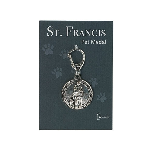 Silver St. Francis pet medal with clasp, featuring saint and animal engraving on dark blue display card with paw prints
