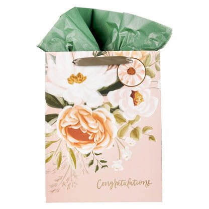 Large peach floral portrait gift bag with green tissue paper and gold foil congratulations text