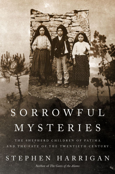 Sepia-toned photo of the three shepherd children of Fatima standing in front of a stone wall with trees in foreground
