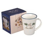 Ceramic Christmas mug with "Feliz Navidad" text and green rim, boxed for holiday gift giving and cozy celebrations.