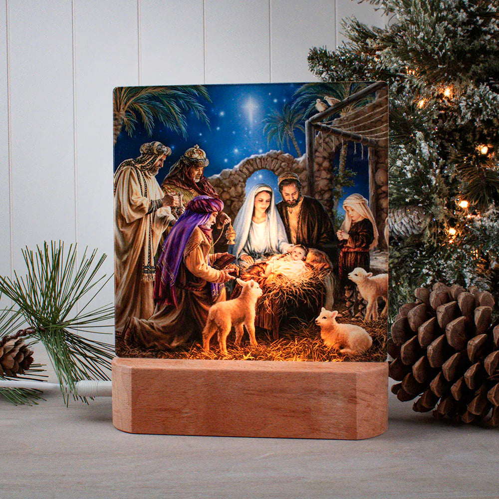 LED tabletop nightlight showing nativity scene with Mary, Joseph, baby Jesus, wisemen, and animals on wooden base