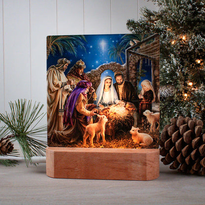 LED tabletop nightlight showing nativity scene with Mary, Joseph, baby Jesus, wisemen, and animals on wooden base