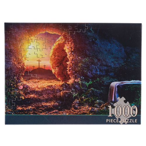 1000-piece jigsaw puzzle featuring the empty tomb at sunrise with three crosses silhouetted on a hill