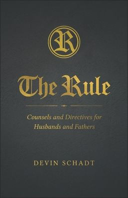 Dark hardcover book titled The Rule with gold embossed text and author Devin Schadt’s name on black cover