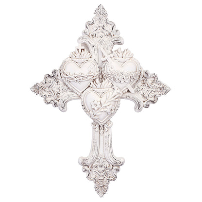 White ornate wall cross featuring the three Sacred Hearts of Jesus, Mary, and Joseph with floral and crown details