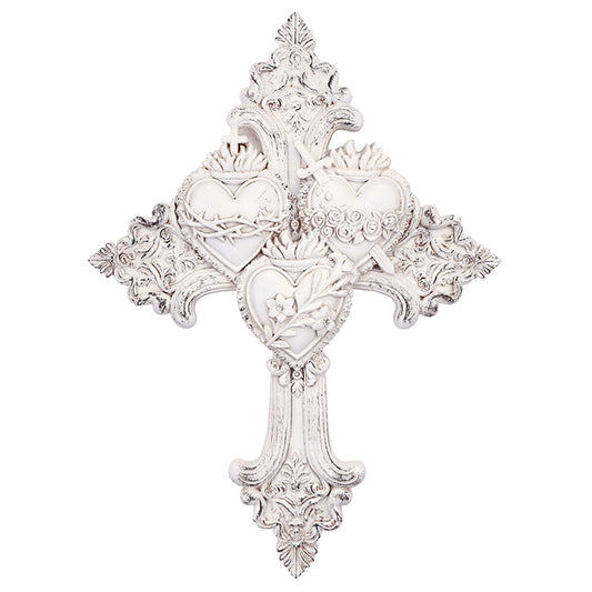 White ornate wall cross featuring the three Sacred Hearts of Jesus, Mary, and Joseph with floral and crown details