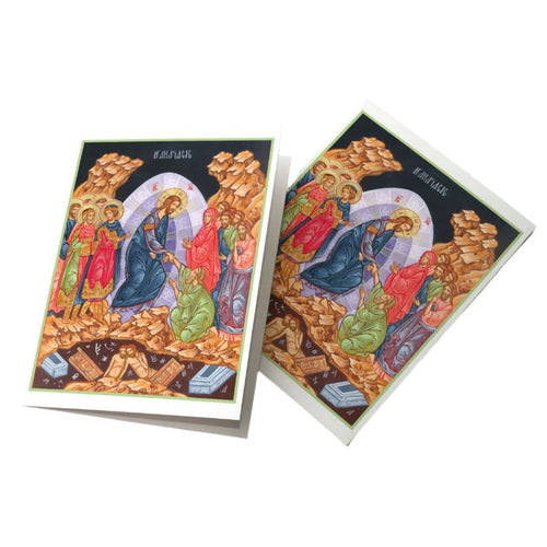 Easter card featuring hand-illustrated religious scene of Christ’s resurrection with vibrant colors on white folded card