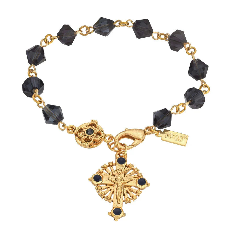 14K gold-dipped bracelet with faceted dark blue beads, lapis enamel crucifix, and petite blue crystal accent charm.