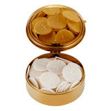 Gold hospital pyx with hinged lid holding round white consecrated Eucharistic hosts on white background