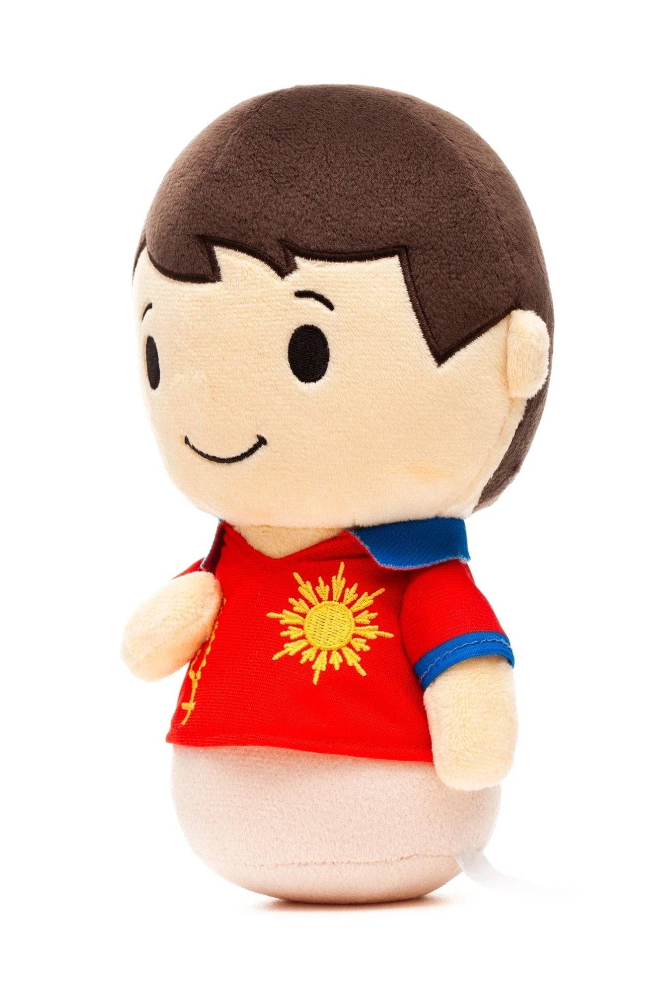 Saint Carlo Acutis plush doll in red shirt with yellow sun emblem and blue collar on white background