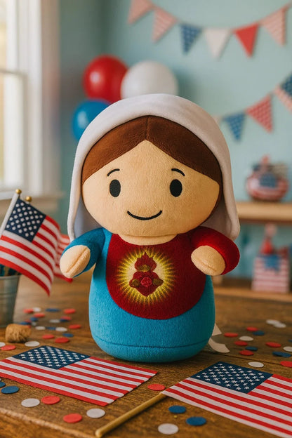 9-inch Immaculate Heart of Mary plush doll with embroidered heart, white veil, and blue and red gown on wooden table