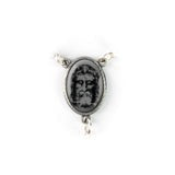 Detailed Shroud of Turin centerpiece on sterling silver, featuring the Holy Face image with ornate frame and chain loops