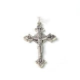 Silver crucifix with intricate detailing and floral accents on Shroud of Turin olive wood rosary chain